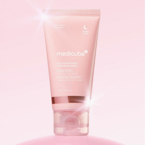Medicube Collagen Night Wrapping Mask tube packaging with glowing effects on pink background.