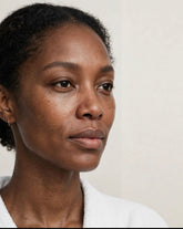 Close-up of a woman with glowing skin, showcasing the effects of Medicube Collagen Jelly Cream hydration.